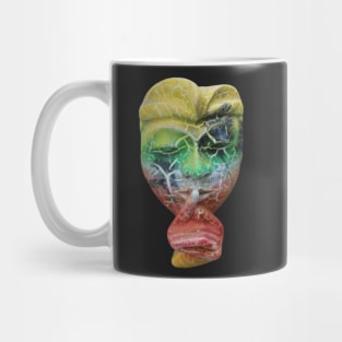 A Bali face mask cut out with finger on its mouth. Mug